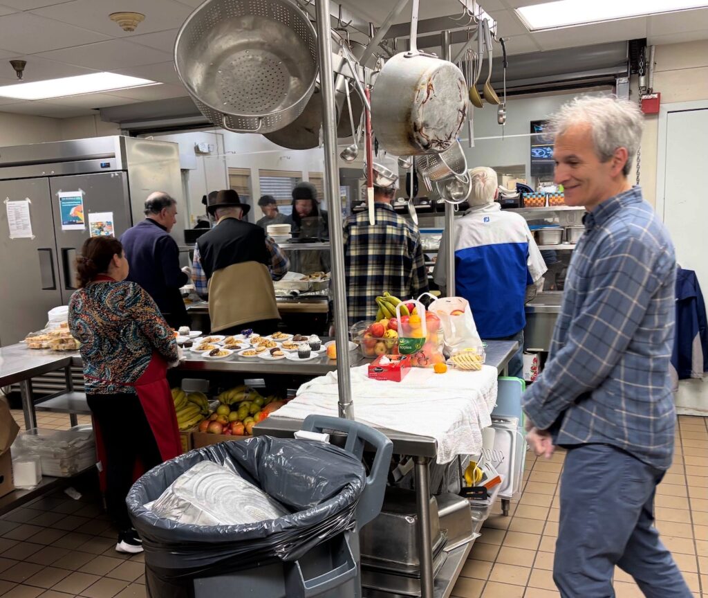 Serving the food to the shelter residents.